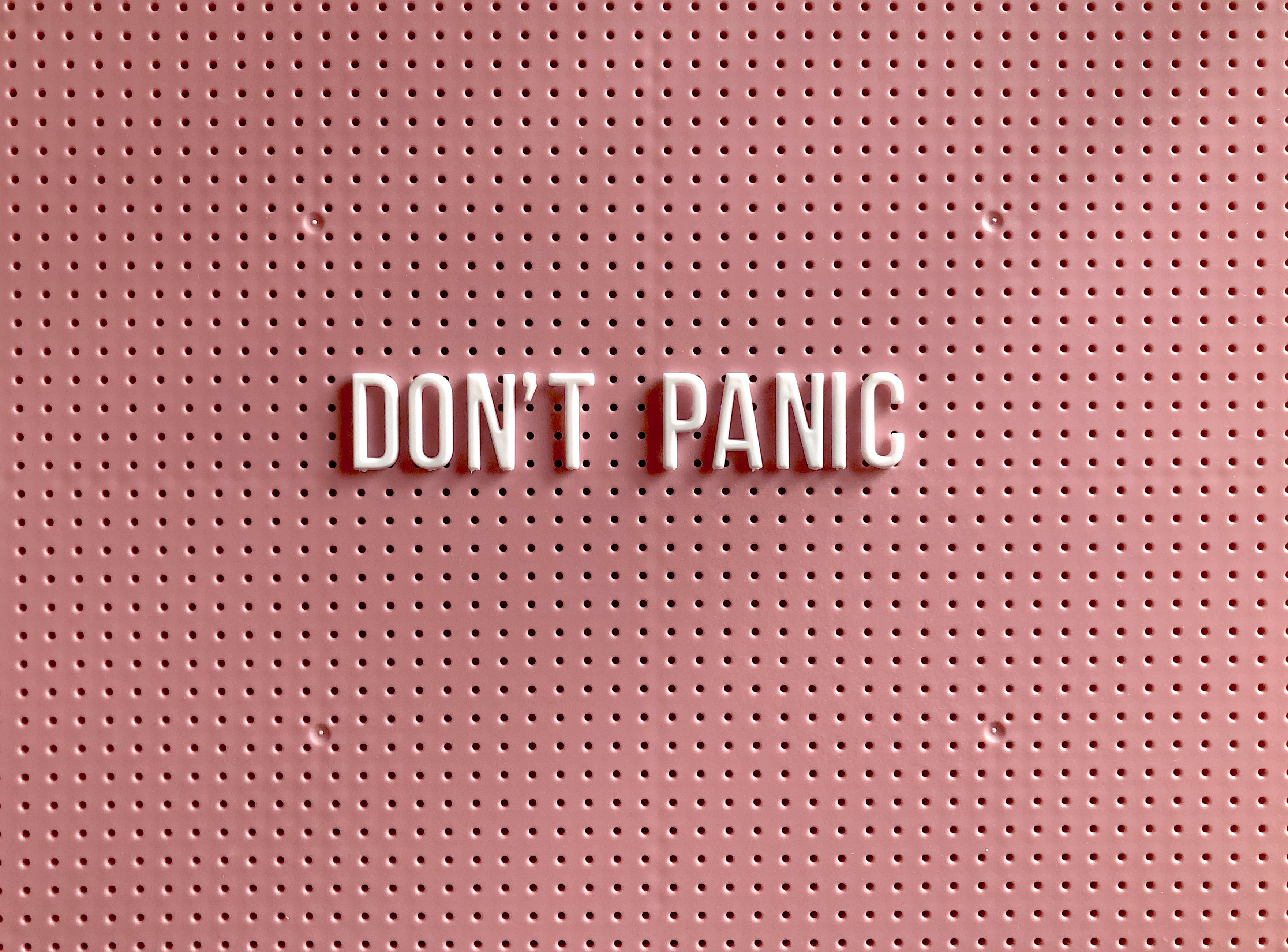 Don't Panic written on a board